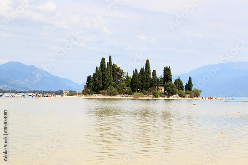 Island Isola di San Biagio at Lake Garda with mountain panorama, Italy