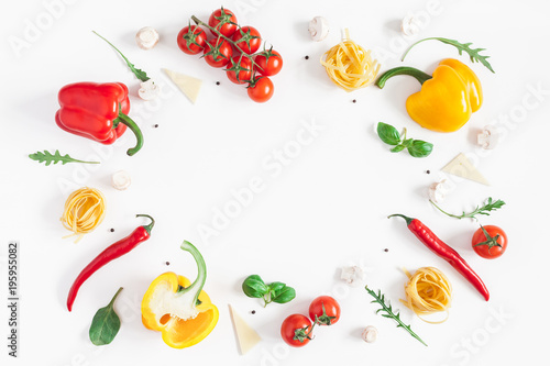 Ingredients for cooking pasta on white background. Fettuccine, fresh vegetables, cheese, mushrooms, spice. Italian food concept. Flat lay, top view, copy space
