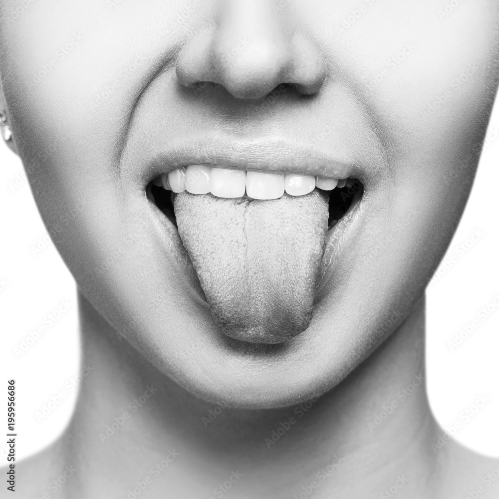 Εκτύπωση καμβά Close-up portrait of woman shows tongue grimace.
