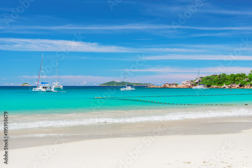 Sailboat at Anse Lazio beach at Praslin island  Seychelles.  Summer vacation and travel concept.  