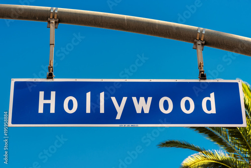 Hollywood boulevard sign, with palm trees in the background.
