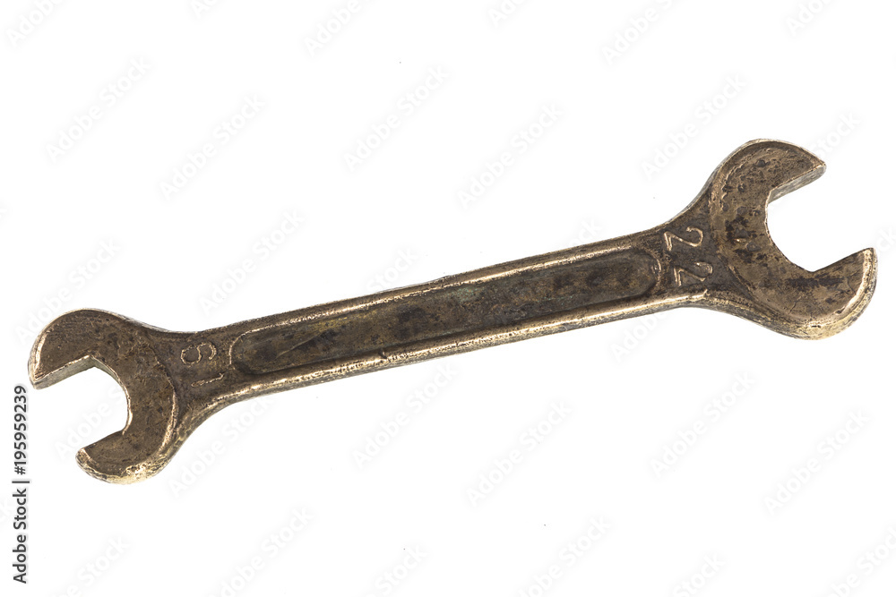 old copper wrench for nuts on white isolated background old copper wrench for nuts on white isolated background