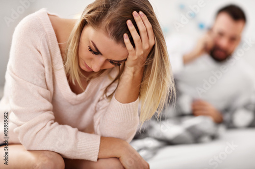 Naklejka Adult attractive couple in bed having problem
