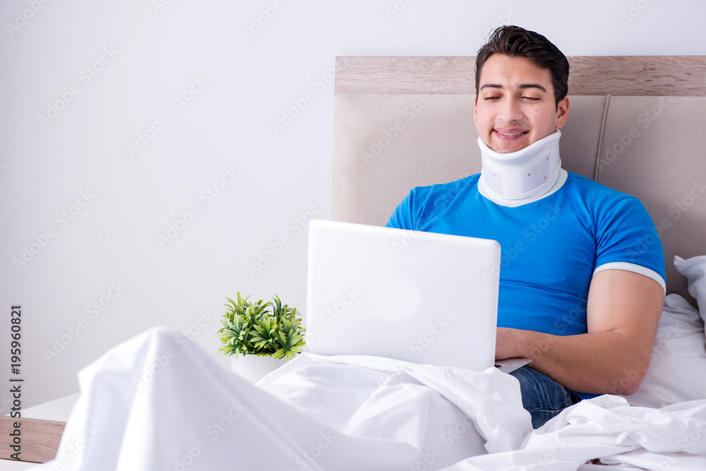 Young man with neck injury in the bed Young man with neck injury in the bed