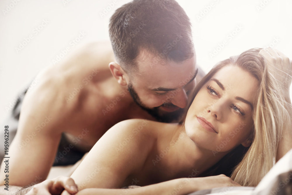 Sexy young lovers being intimate in bed Sexy young lovers being intimate in bed