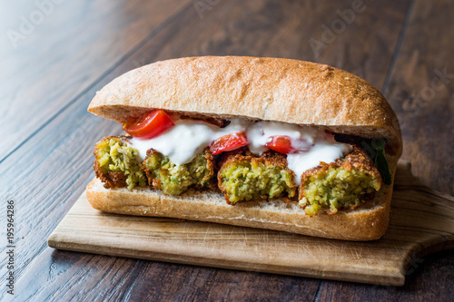 Chickpea Falafel Sandwich with Tomatoes and Sauce photo