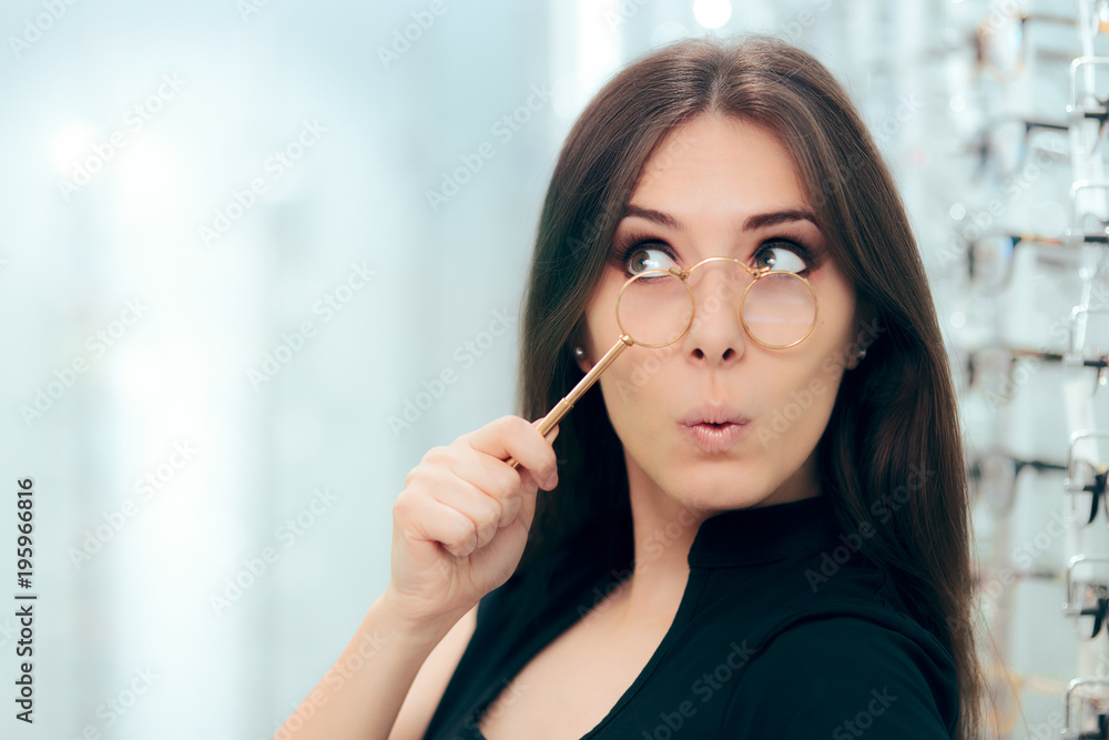 Woman Looking To Replace Old Lorgnette Glasses with New Pair Woman Looking To Replace Old Lorgnette Glasses with New Pair
