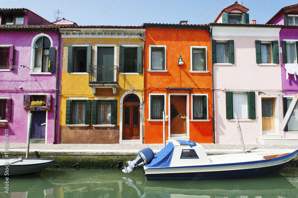 Venice, Burano island, Italy - scenic view of characteristic colorful buildings and the canal