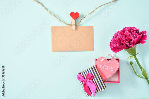 May Mother's Day Carnation Bunch of Flowers Bouquet with love gift and Blank Greeting Card with Love and Hemp Rope Top View, Blank for Text, Blue Green 