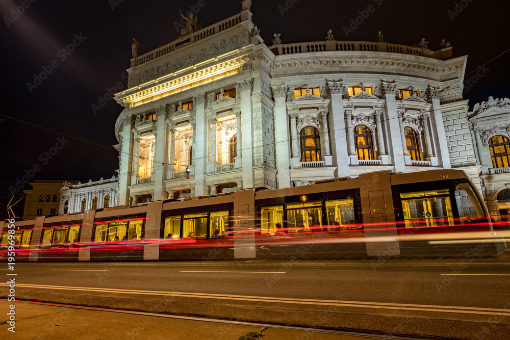 Night shot of tram at Burgtheater Vienna