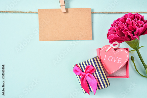 May Mother's Day Carnation Bunch of Flowers Bouquet with love gift and Blank Greeting Card with Love and Hemp Rope Top View, Blank for Text, Blue Green 