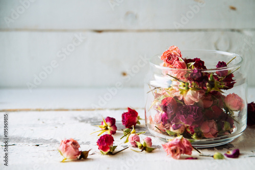 Rose buds tea, tea strainer and glass jar. Selective focus. photo