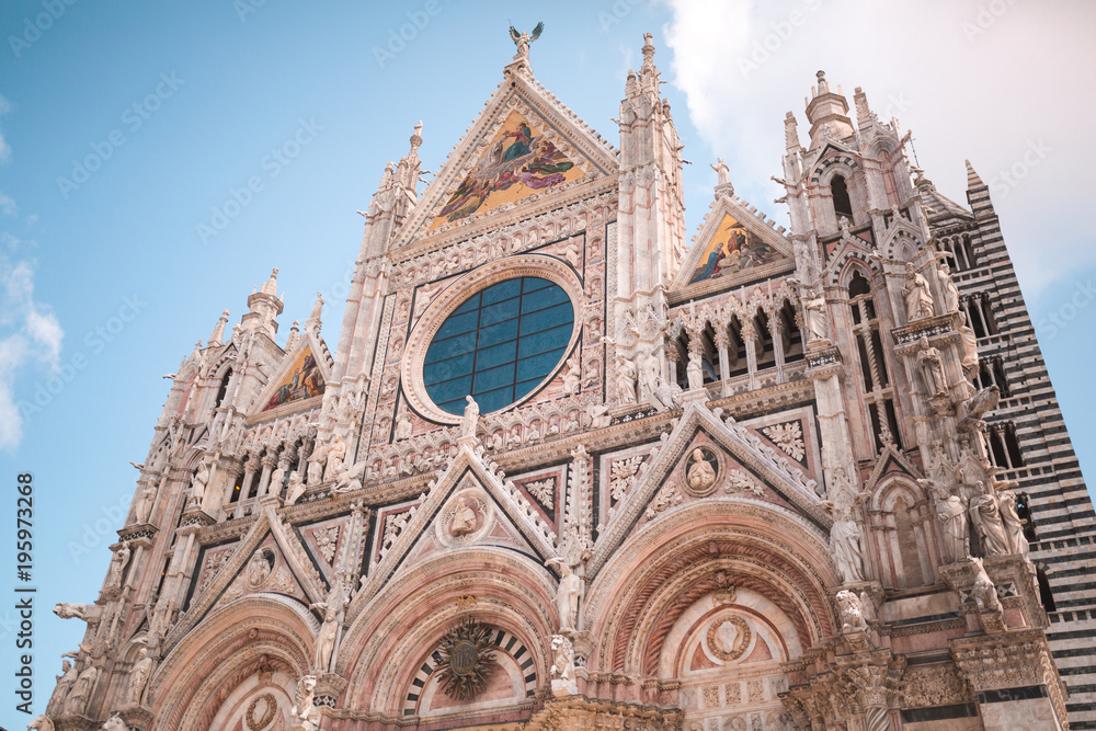 Siena Cathedral facade with rose window and mosaic