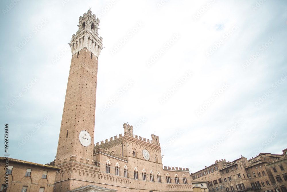 Mangia Tower with clock in Siena city