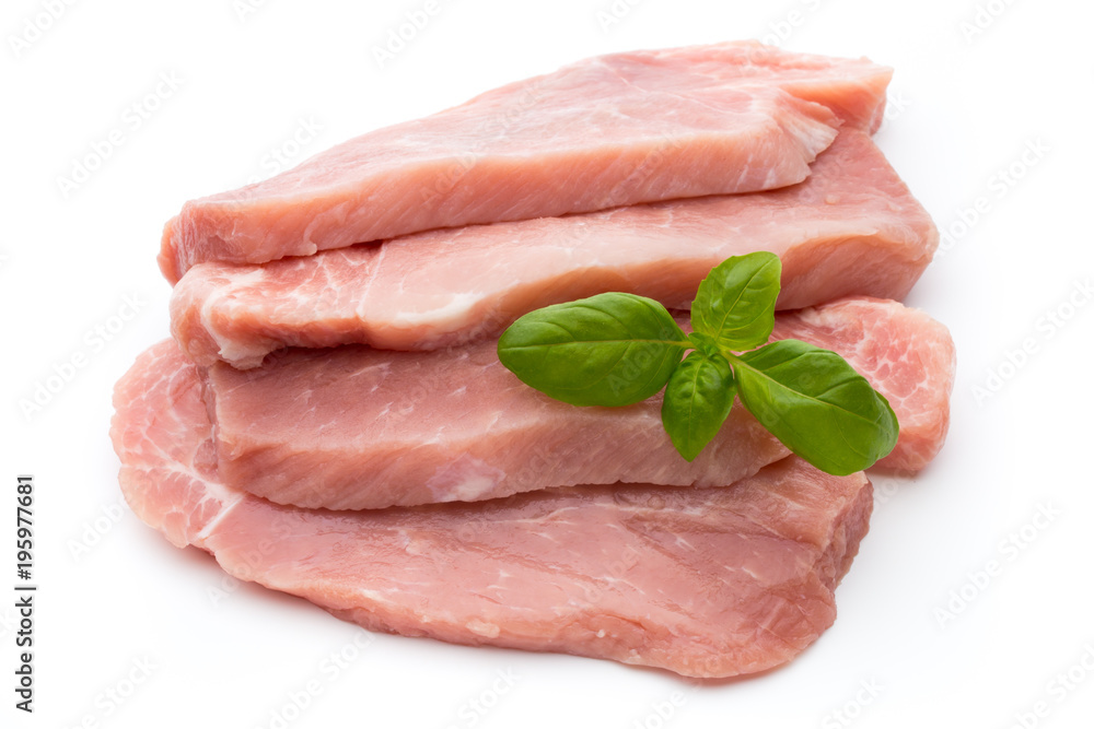 Fresh pork fillet with basil on a white background. Fresh pork fillet with basil on a white background.