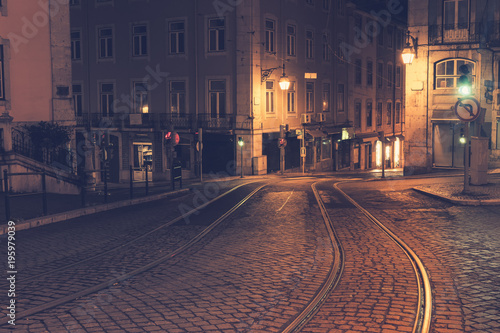 Illuminated street of old european town at night
