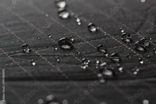 Rain Water droplets on  black waterproof fabric