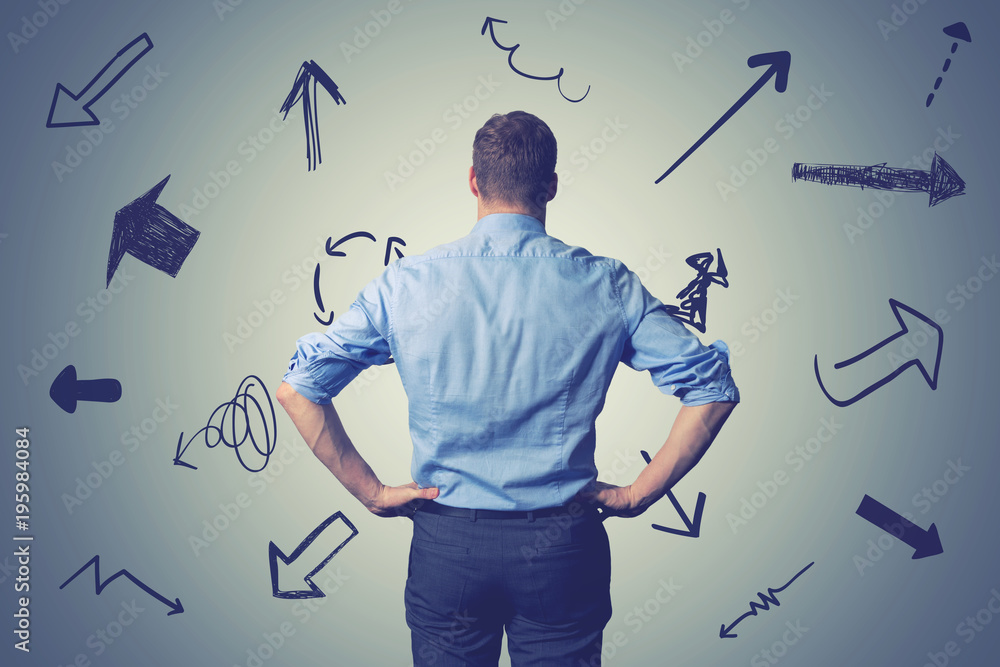 confused businessman with direction arrows. choosing the right way decision concept - obrazy, fototapety, plakaty 