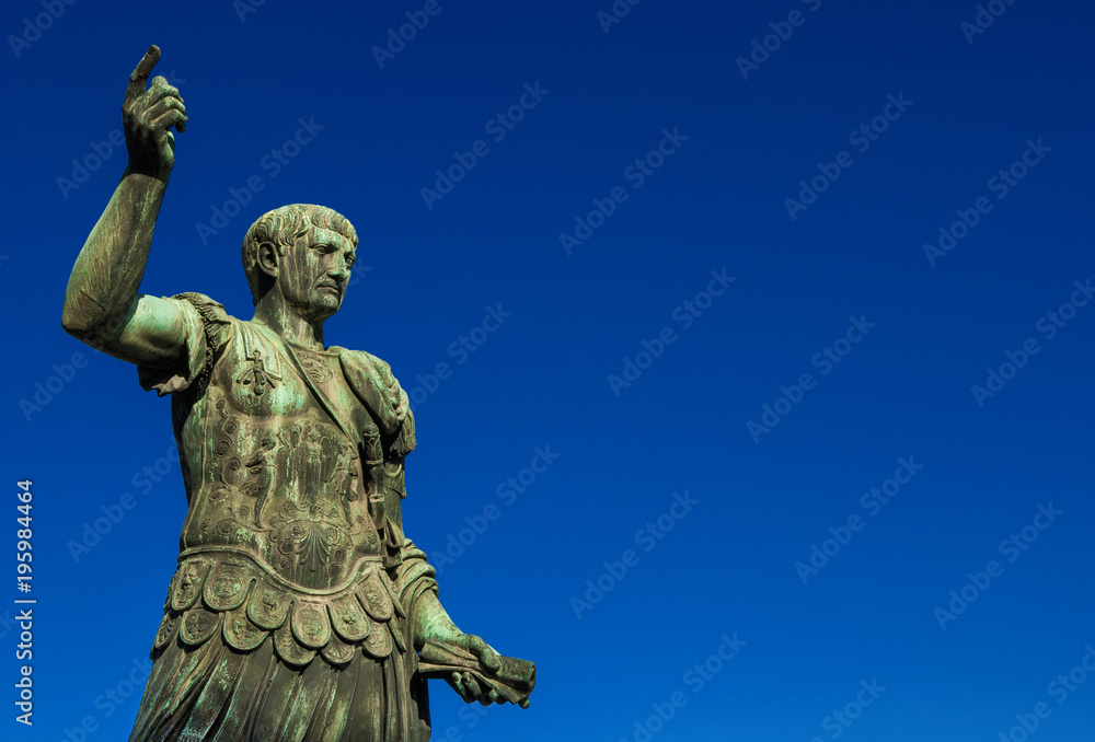 Trajan the conqueror, one of the greatest  ancient roman emperor, bronze statue along Imperial Fora avenue in the very center of Rome (with copy space)