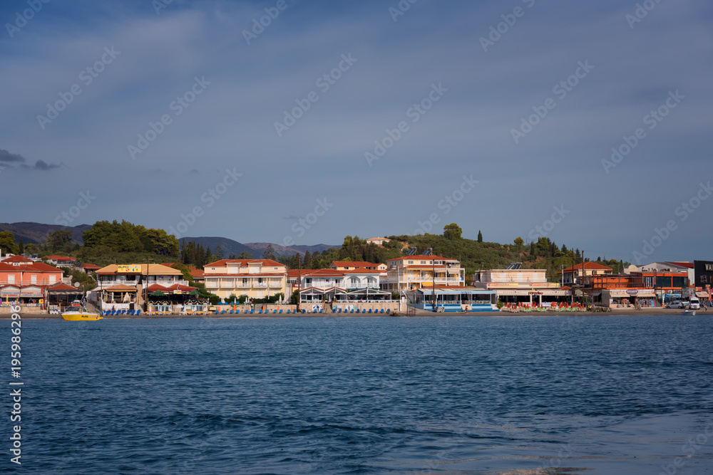 View from the sea to the beach of Agios Sostis, Zakynthos Island, Greece.Typical island architecture.