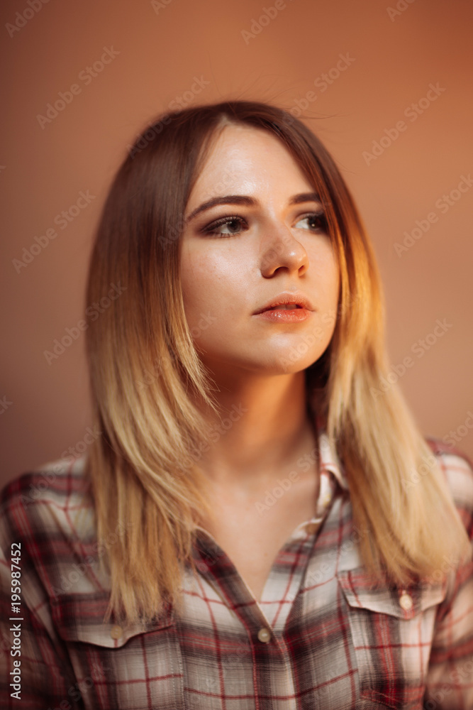portrait smiling girl on orange background in studio portrait smiling girl on orange background in studio