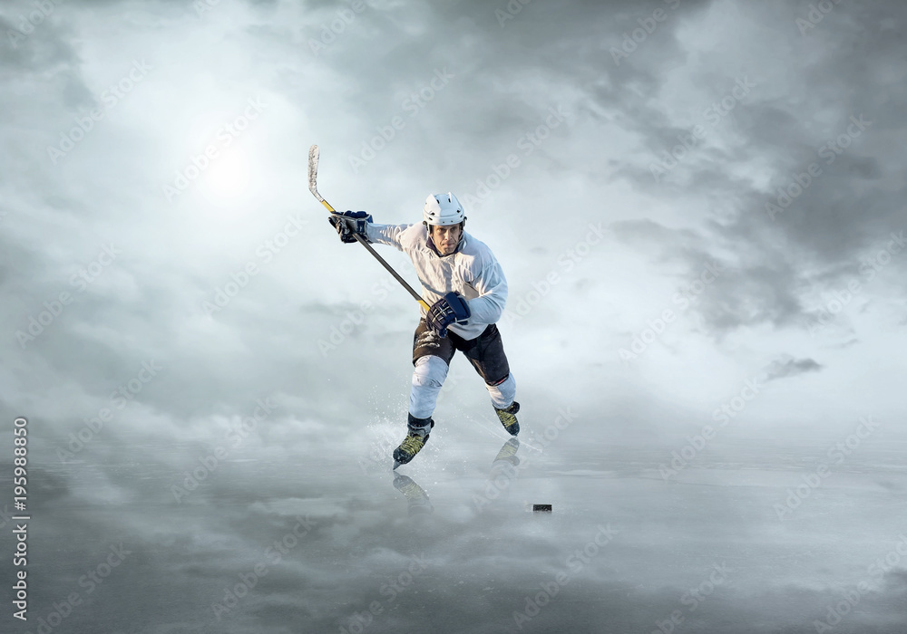 Ice hockey player in action outdoor around mountains