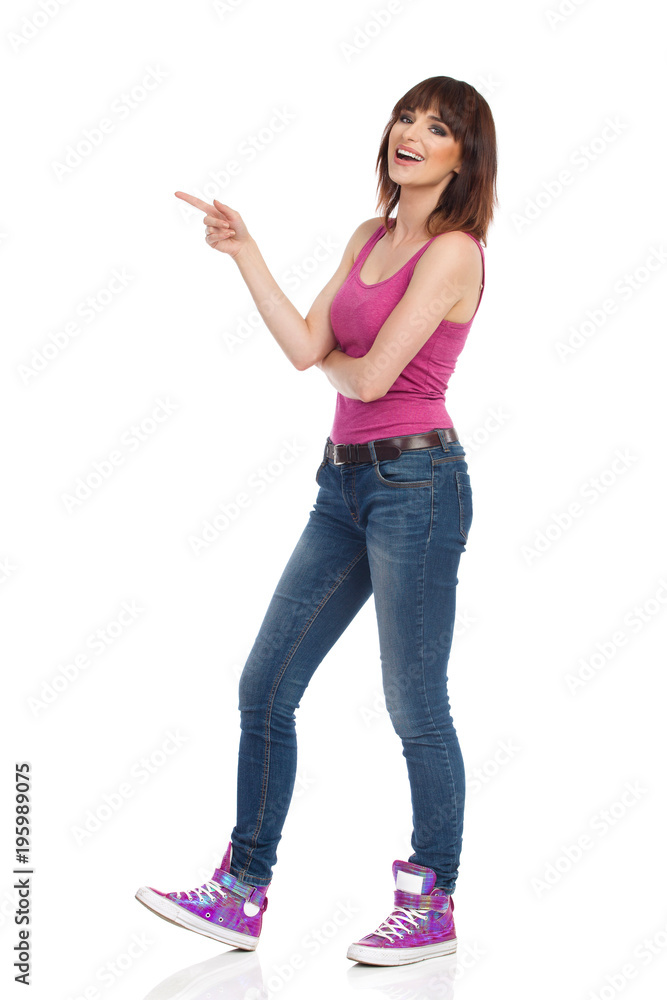 Laughing Young Woman Is Pointing And Looking At Camera Laughing Young Woman Is Pointing And Looking At Camera