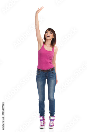 Young Woman Is Standing, Waving Hand And Shouting