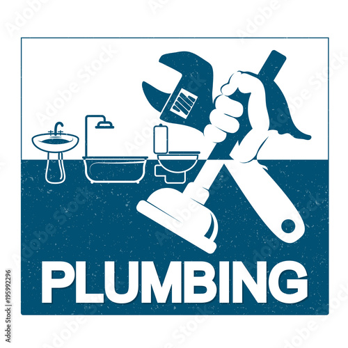 Plumbing repair with a wrench in his hand