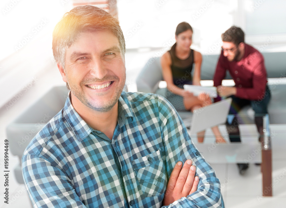 Fototapeta premium Smiling mature businessman in plaid shirt foreground