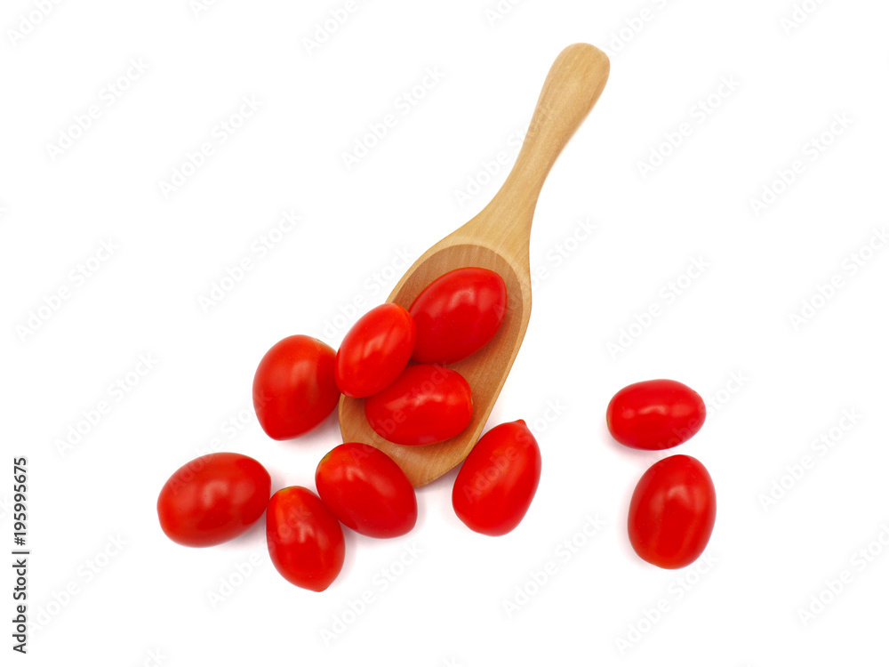 Fresh grape or cherry tomato with wooden spoon on white background.