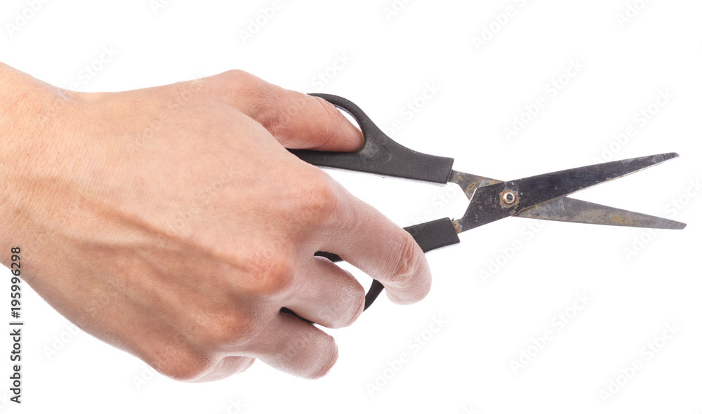 Female hand holding scissors, isolated on white background Female hand holding scissors, isolated on white background