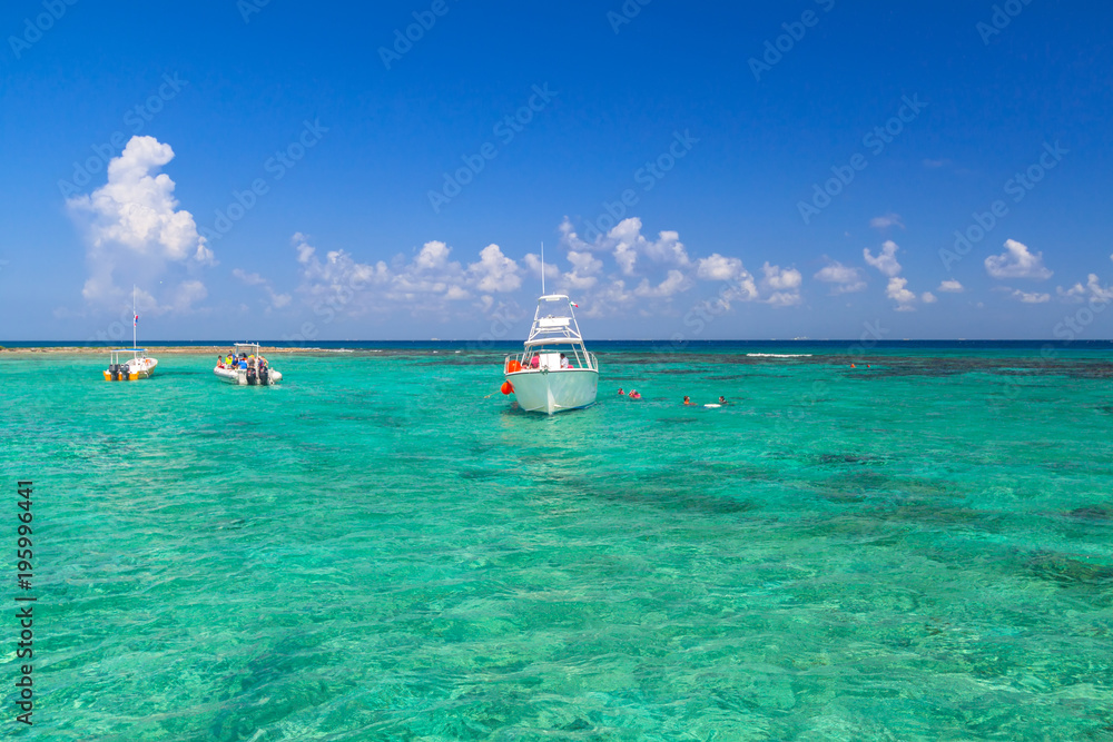 Snorkeling boat on turquise Caribbean Sea of Mexico