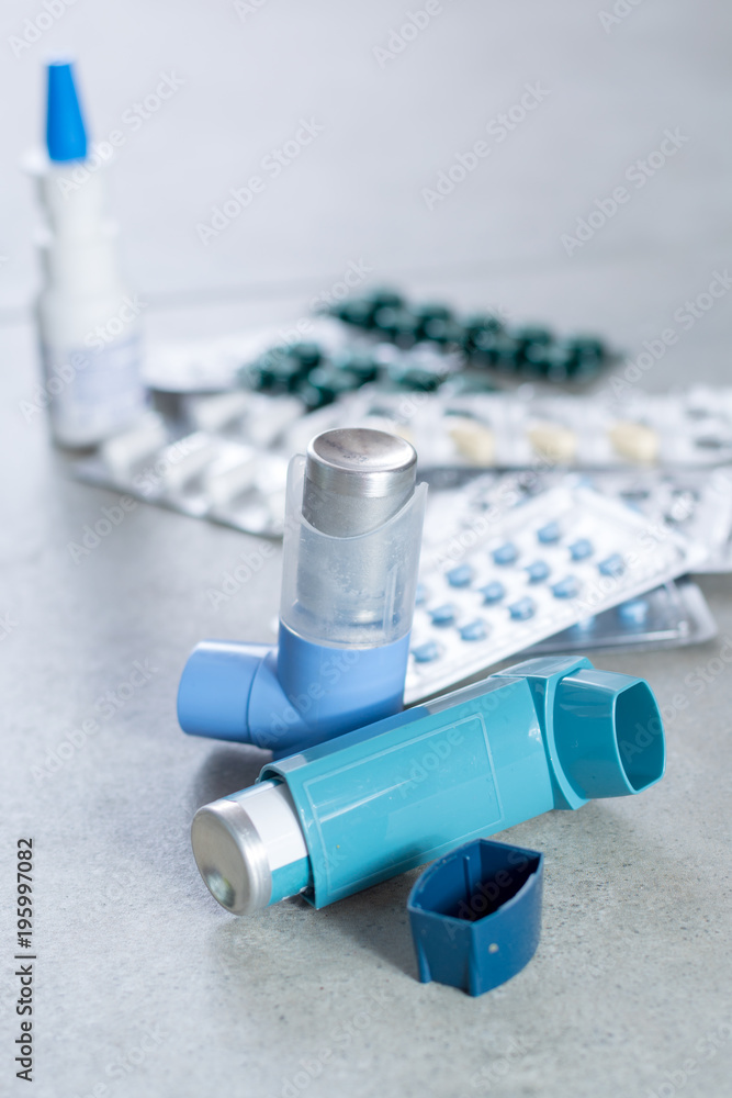 Pills and inhalers for asthma, bronchitis, lungs diseases, spring seasonal allergy Stock Photo