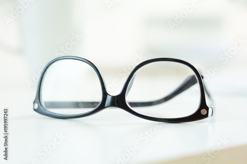 Eyeglasses on white table
