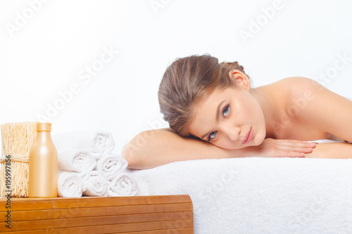 Young, beautiful and healthy woman in spa salon.