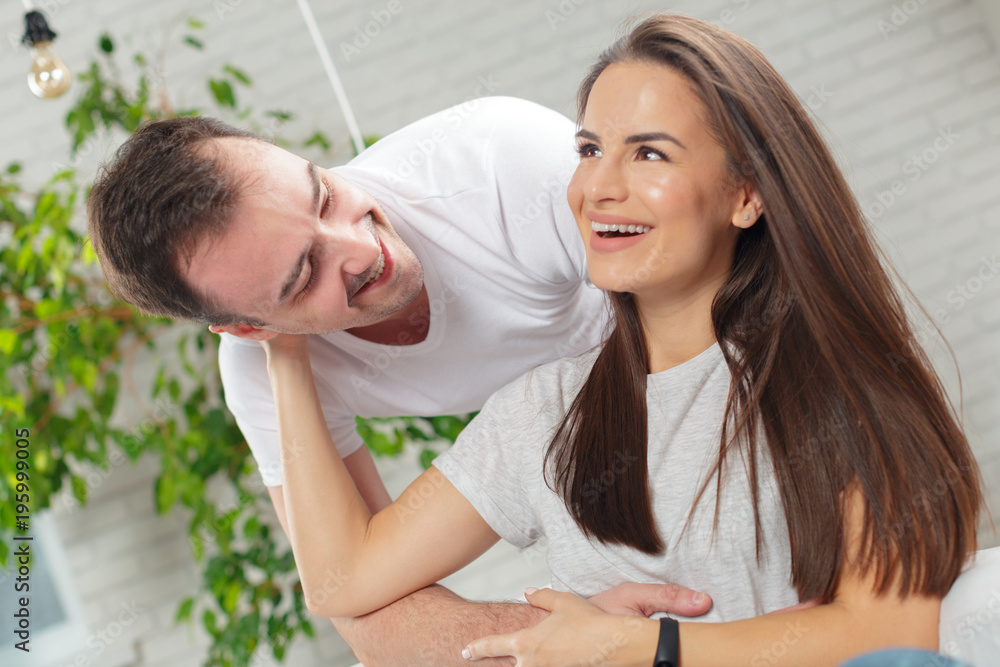 Fototapeta premium Cheerful young couple in the morning at home