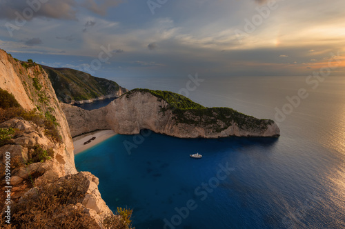 Ship Wreck beach and Navagio bay at sunset. The most famous natural landmark of Zakynthos, Greek island in the Ionian Sea.
