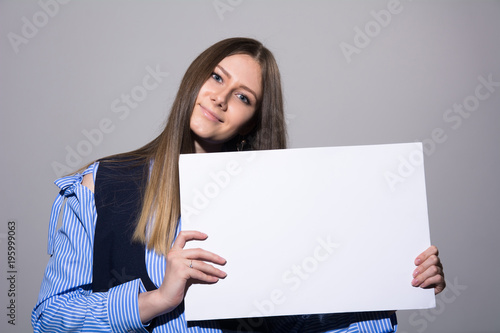 Portrait of a young woman with a blank white banner photo