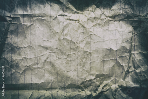 Crumpled old lined white paper with vignette