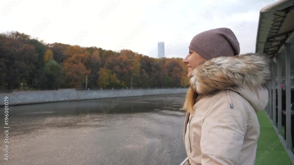 Woman Walks To Float Boat Board And Enjoys View Of Multicolored Park In Autumn Woman Walks To Float Boat Board And Enjoys View Of Multicolored Park In Autumn