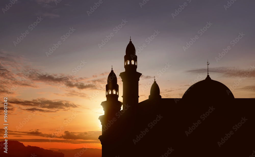 Silhouette of big mosque with high minaret Silhouette of big mosque with high minaret