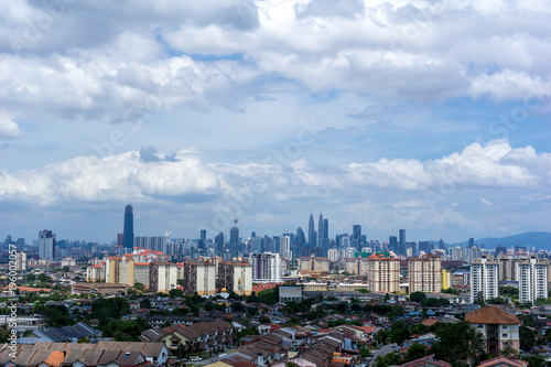 A clear and windy day in Kuala Lumpur, capital of Malaysia. Its modern skyline is dominated by the 451m tall KLCC, a pair of glass and steel clad skyscrapers.