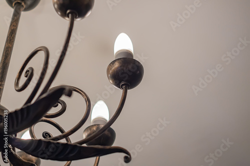 retro styled chandelier on ceiling, closeup