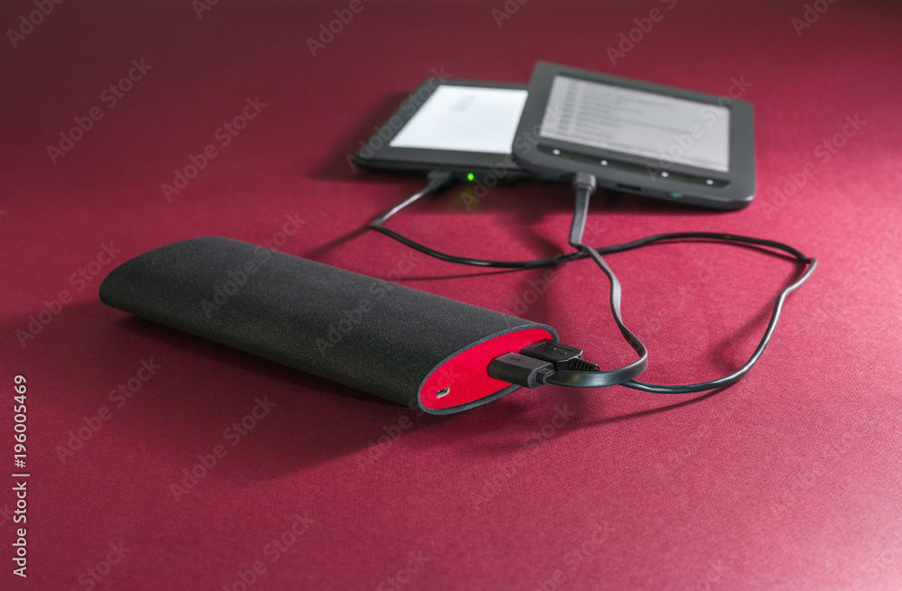 Powerbank on red background Powerbank on red background