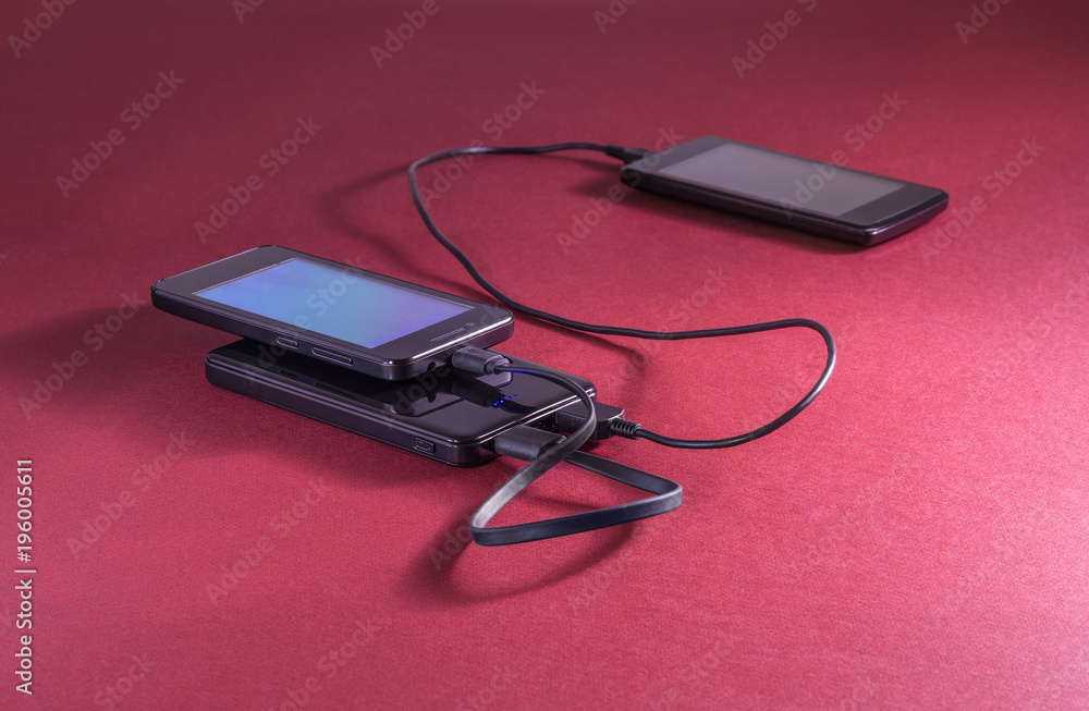 Powerbank on red background Powerbank on red background