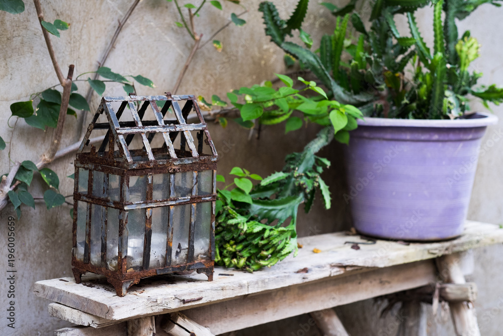 Vintage style candle holder on shelf in the garden