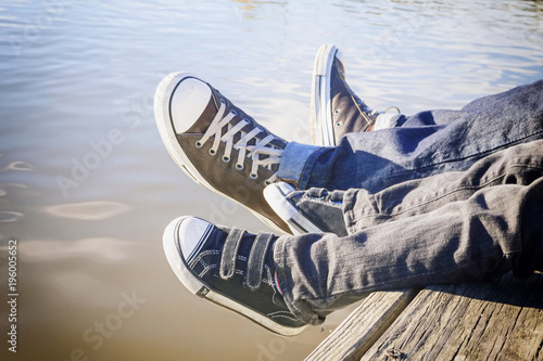 Dad and Son Chilling on the Dock