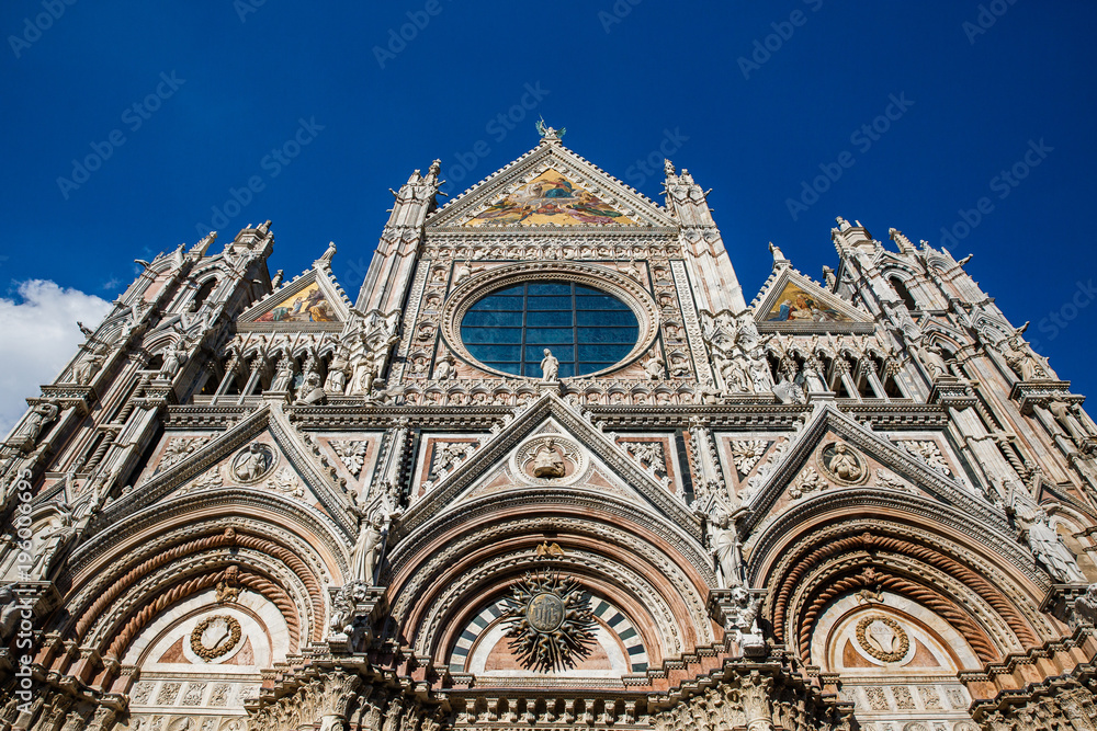 Scenic view of Siena Cathedral Santa Maria Assunta (Duomo) facade. Location Tuscany, Italy. Picturesque travel destination postcard.