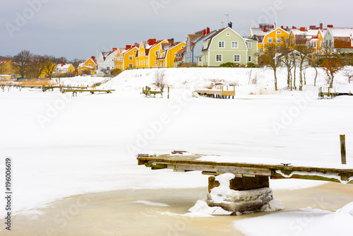 Wallpaper Mural Colorful seaside homes on Salto island in Karlskrona, Sweden. Ice and snow in the wintry landscape. Torontodigital.ca